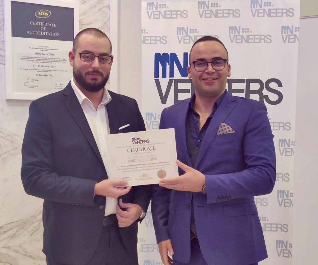 The dental office alpha dental and Dr Younes Doukani receives the certificate of best dentist in dental veneers nnn veneers in Algeria and Africa in Dubai by nnn veneers
